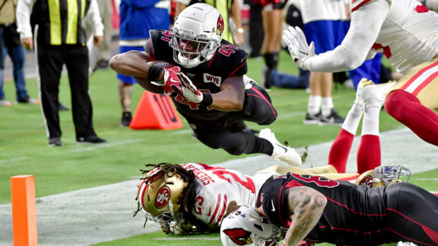 Oct 31, 2019; Glendale, AZ, USA; Arizona Cardinals running back Kenyan Drake (41) dives over San Francisco 49ers cornerback Richard Sherman (25) to score a touchdown  in the first quarter at State Farm Stadium. Mandatory Credit: Matt Kartozian-USA TODAY Sports